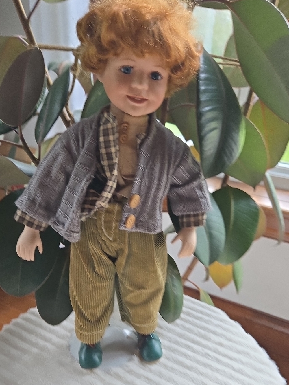 Porcelaine. Boy Doll in Green and Brown Outfit